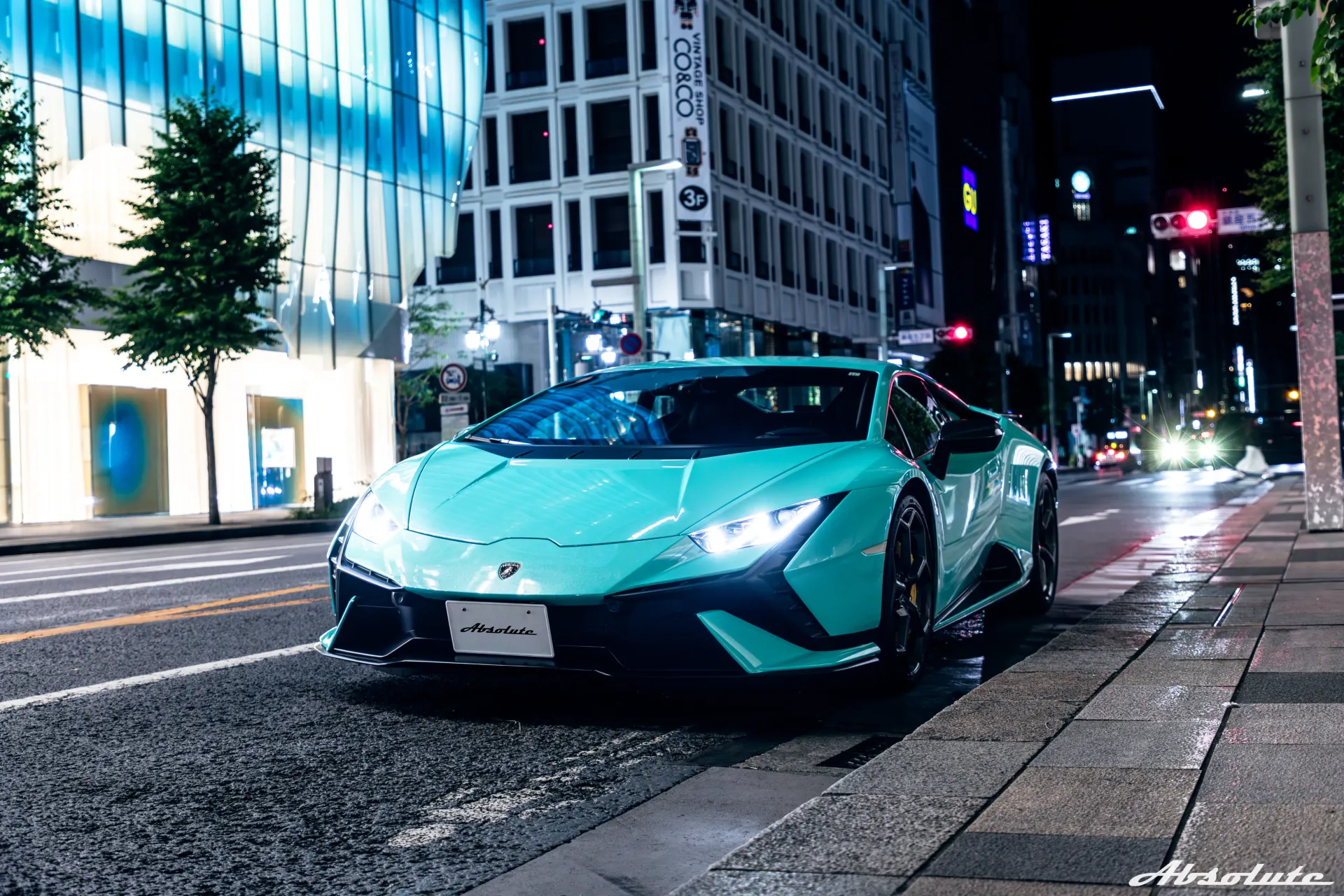 Absolute Lamborghini on a city street at night