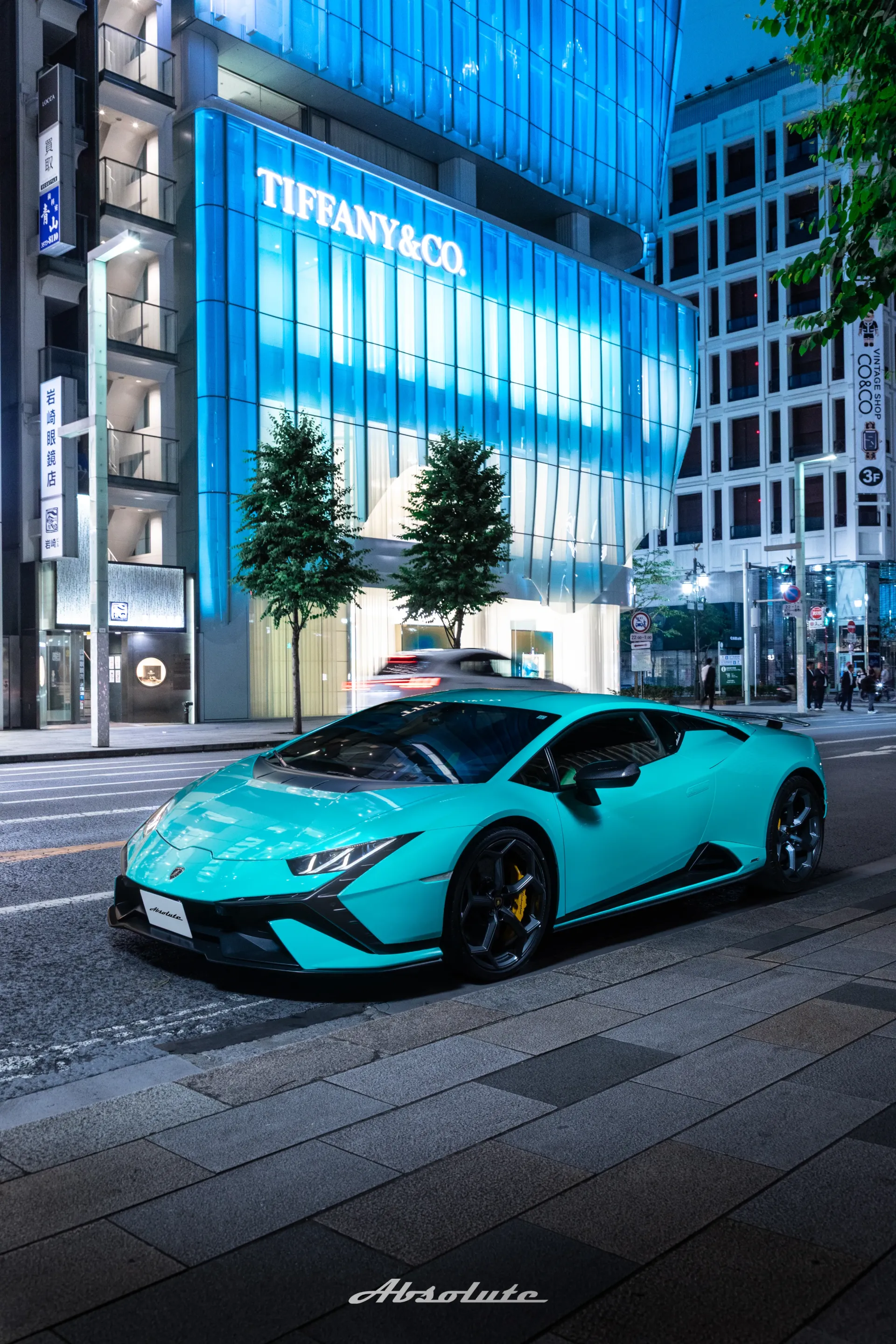 Absolute Lamborghini in front of a Tiffany storefront